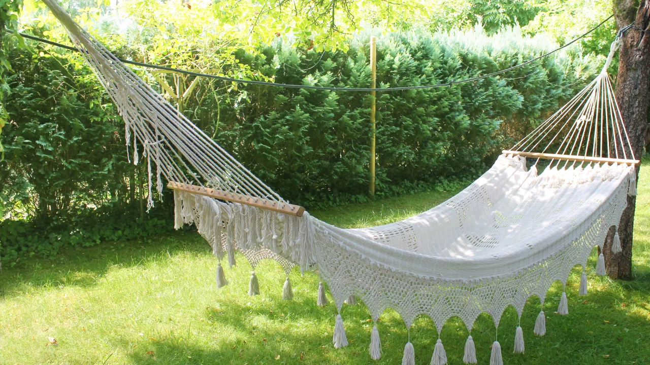 Different types of hammocks, including single, double, indoor, and outdoor hammocks, shown in a variety of settings.