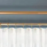 Different types of curtain rails including rod, track, and bay window options. A guide to choosing the right curtain rail for your home.