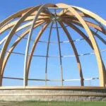 Different types of dome home framing, including geodesic and monolithic domes, showcasing their unique structures and architectural styles.