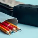 Comparison of different pencil case types, including zippered, mesh, and other organizer options. Variety of pencil cases shown with pencils and pens inside.