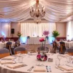 Various prom venue decoration ideas, including elegant ballroom setups, modern unique designs, balloon arches, creative centerpieces, and lighting options for prom night inspiration.